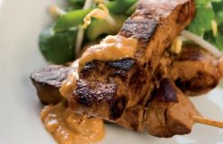 Marinated pork satays with peanut sauce and a bean sprout salad