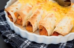 Chicken enchiladas with tomato and sour cream